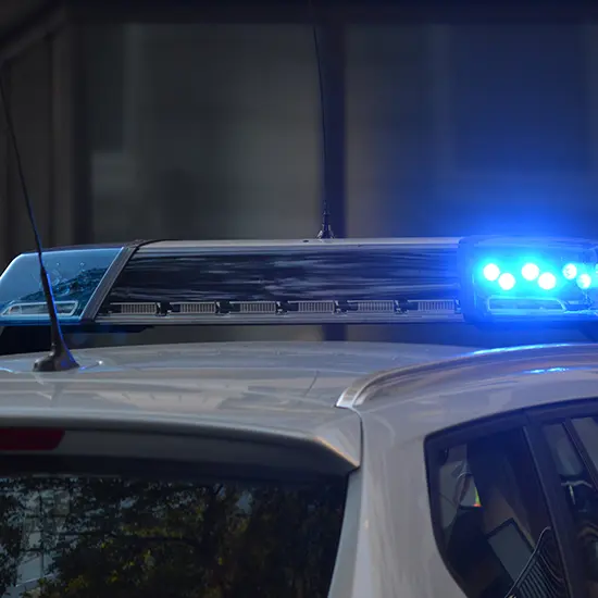 A police car with its lights on.