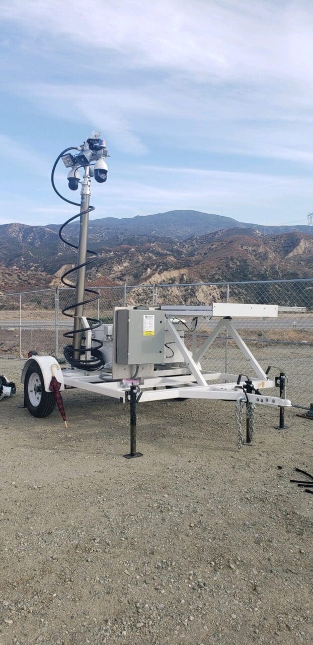 A trailer with a light and antenna on it